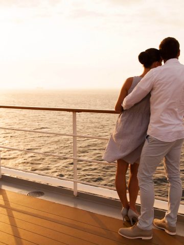 Couple on a cruise at sunset - 7 day cruise packing list