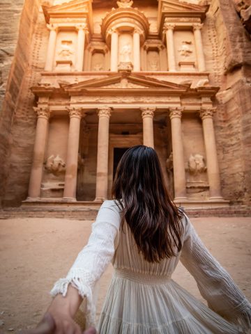 Woman wearing white dress at Petra - Can I wear a dress to Petra? What to wear in Jordan