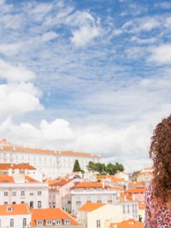 Woman looking over Lisbon skyline