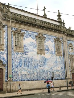 Tourists in front of the Carmo Church in Porto