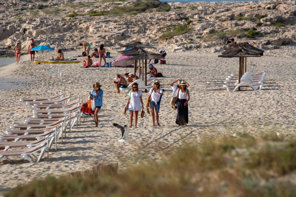 Tourists on beach in Spain in June