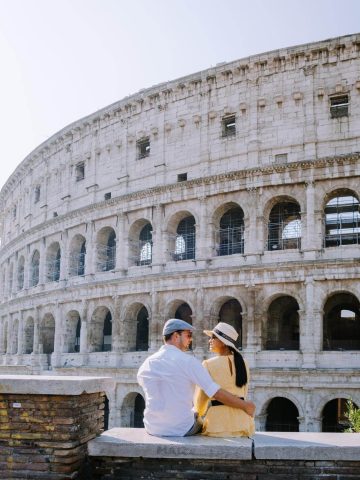 Couple in front of the colosseum in Rome in September