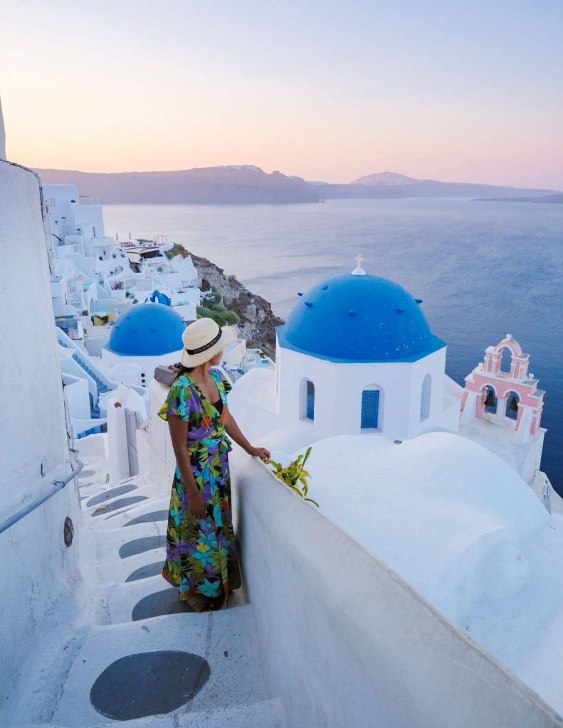 Woman in Santorini in Maxi dress and hat