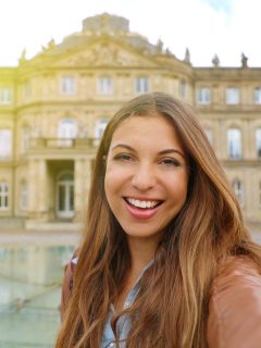 Woman in front of Neues Schloss New Palace in Stuttgart Germany