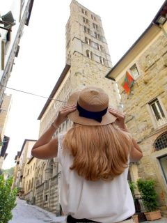 Woman in sun hat in Arezzo in Tuscany