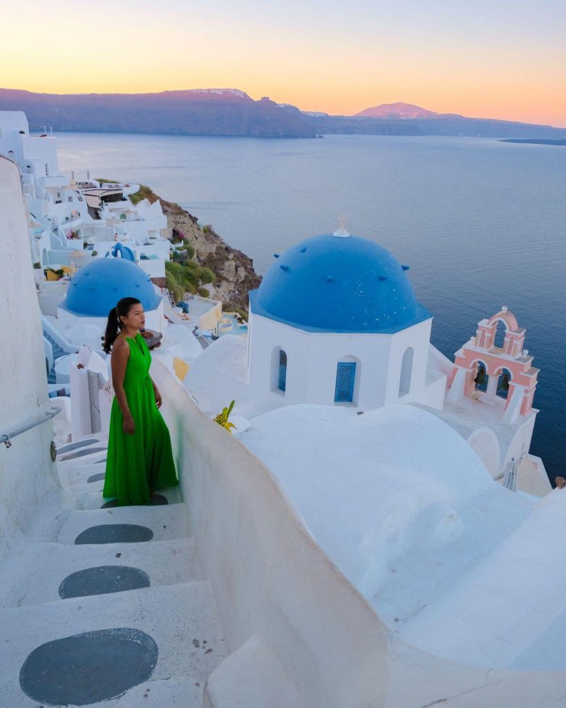 Woman in Green dress in Santorini Greece