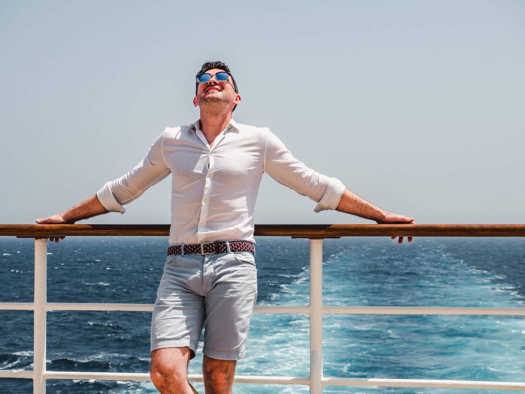 MAn in shorts and shirt on a cruise ship