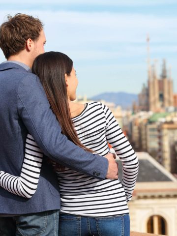 Couple overlooking Barcelona skyline in October