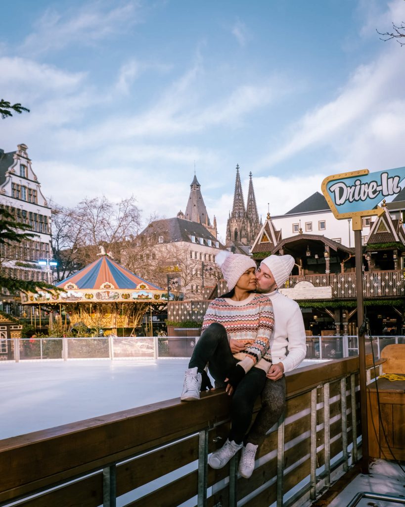 Couple at ice rink at Chrsitmas MArket in Germany in December