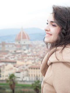 Woman looking at FLorence Skyline in Tuscany in NOvember