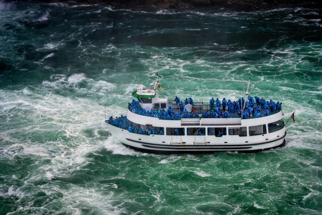 Boat at Niagara Falls with tourists