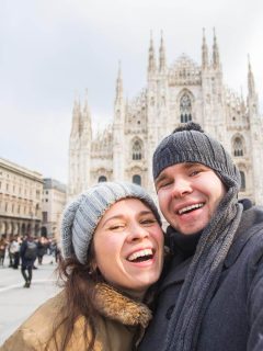 Couple in front of Duomo Milan in winter