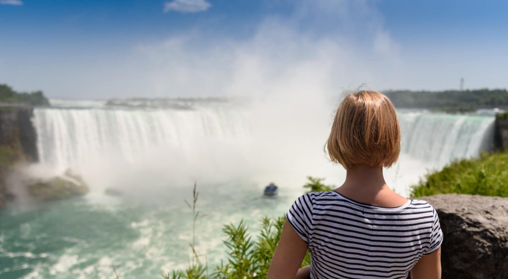 Woman overlooking Niagara Falls in Summer