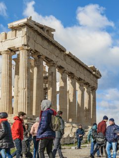 People in Winter clothes at the Acropolis in Greece in January