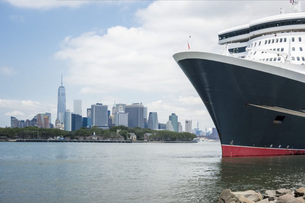 Cunard Cruise Ship in Port with city skyline in background