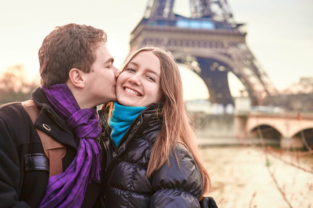 Couple in front of Eiffel Tower in Paris in February