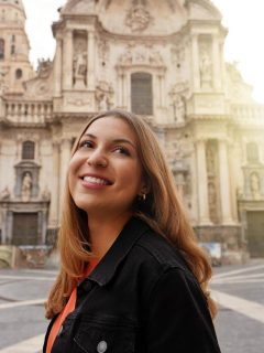 Woman in front of Murcia cathedral in Spain in March