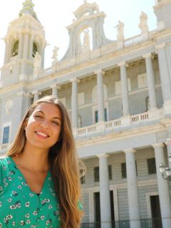 Woman in front of Almudena cathedral in Madrid in Spring