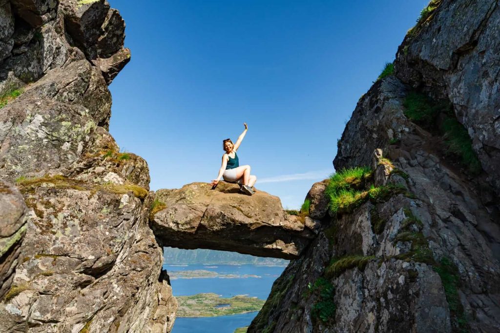 Woman on rocks at Djevelporten in Norway Lofoten Islands