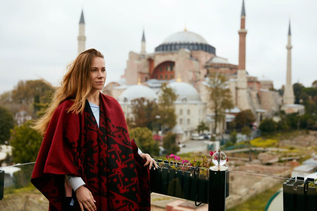 Woman stood in Istabul in front of Hagia Sophia in Winter